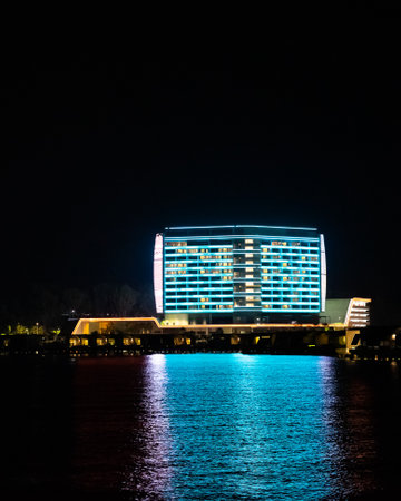 Port Dickson, Malaysia - December 19, 2020: Colourful neon lights at Lexis Hibiscus Hotel and resort at night. The image contain soft focus, noise and grain.のeditorial素材