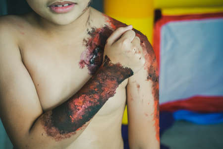 Boy with halloween zombie make up in outdoor.の写真素材