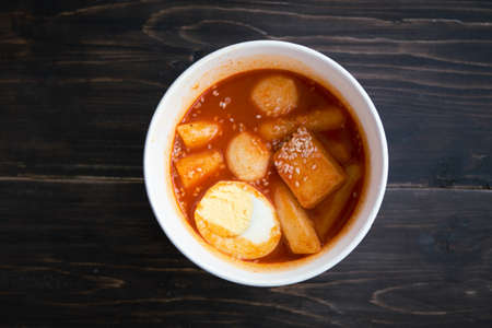 Stir-fried Rice Cake Tteok-bokki in a takeaway container. Korean food delivery.の写真素材