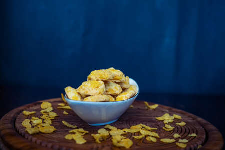 Homemade Cornflake cookies on a wooden background.