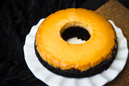 Homemade Creme Caramel Custard Pudding with chocolate cake.の写真素材