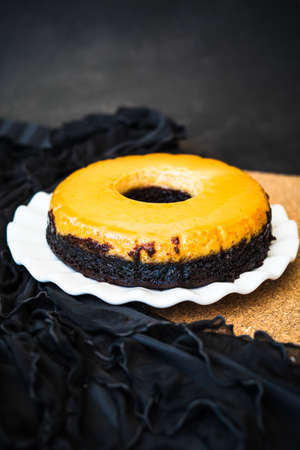 Homemade Creme Caramel Custard Pudding with chocolate cake.