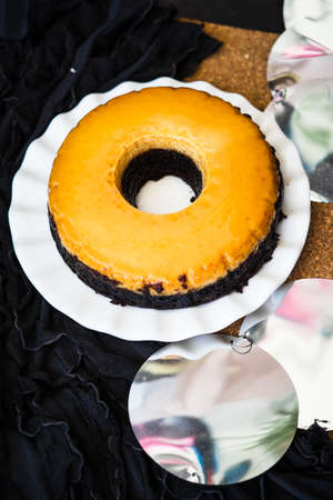 Homemade Creme Caramel Custard Pudding with chocolate cake.の写真素材