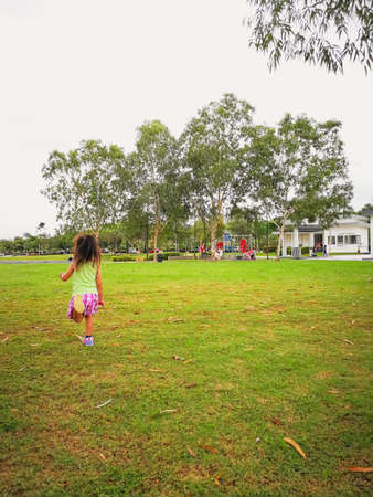 Nilai, Malaysia - November 30, 2019: Children running and playing in the park.のeditorial素材