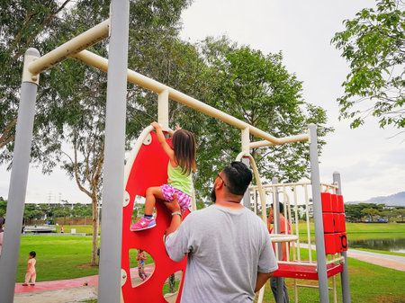 Nilai, Malaysia - November 30, 2019: Family recreation at the playground.のeditorial素材