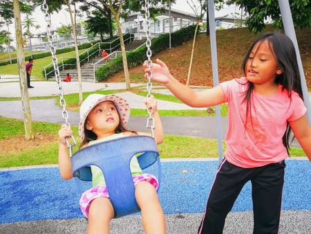 Nilai, Malaysia - November 30, 2019: Family recreation at the playground.のeditorial素材