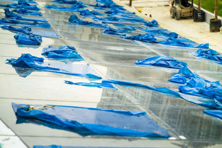 High-tech architecture glass roof. External structure of glass roof with plastic covers in a construction site.の写真素材