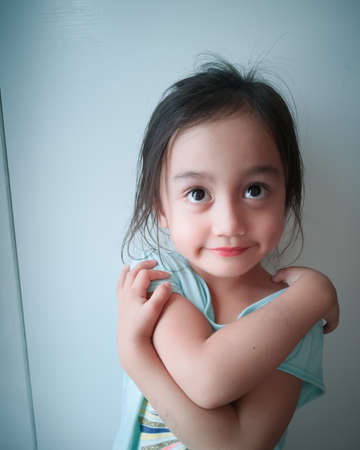 Portrait of a happy cute child Asian girl.の写真素材