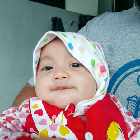 Portrait of curious looking baby kid with the big eyes.の写真素材