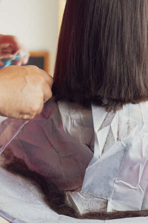 Blurry photo of hair cut session. Close up.