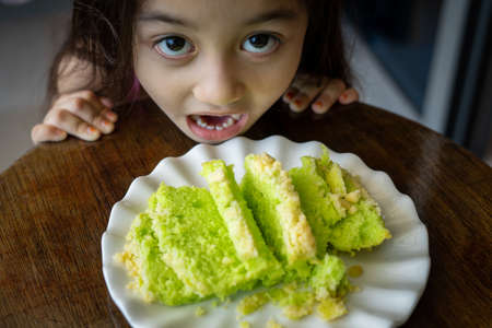 Pandan green cake with butter crumbs.