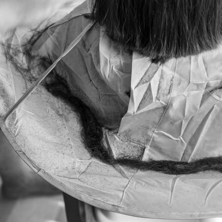 Soft focus of hair cut session. Close up. Monochrome, black and white.の写真素材