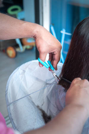 hand doing hair cut. Close up.の写真素材