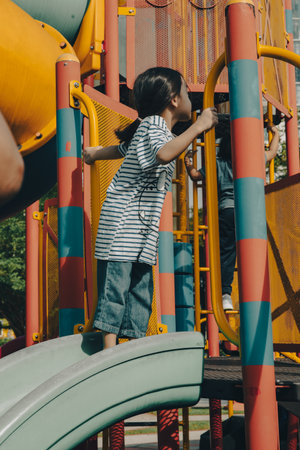Little girl playing at the playground.の写真素材