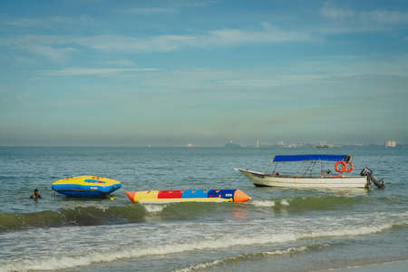 PORT DICKSON, MALAYSIA -Nov 19, 2021: Banana boat for rent at Port Dickson Beach in Malaysia.
