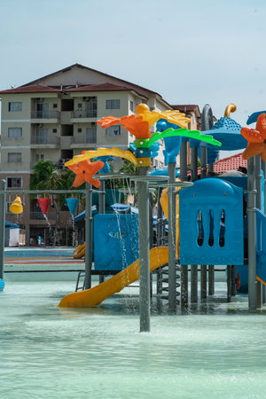 Port Dickson, Malaysia - Nov 19, 2021:   Colourful water splashes from playground at the Ehsan Water...