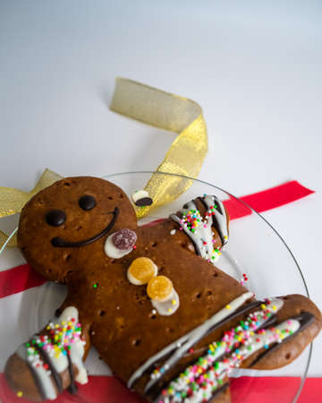 Gingerbread man and Christmas decor on white background.の写真素材