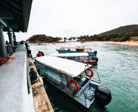 Redang, Malaysia - May 9, 2022: Tourist boats at the jetty.のeditorial素材