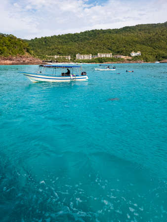 Boats, turquoise water and white sand beach, Redang Island, Malaysia