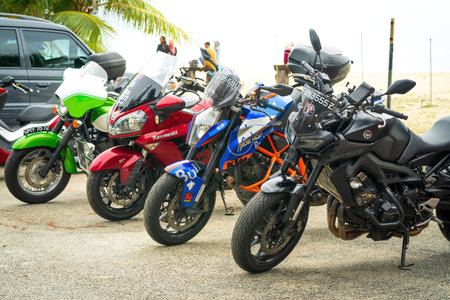 Kuala Terengganu, Malaysia - June 25, 2022:  A row of motorcycle parking along the roadside during Terengganu bike week events.のeditorial素材