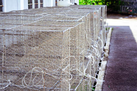 Textured mesh - gabion to strengthen the slope. Gabion box or wire box is stackedの写真素材