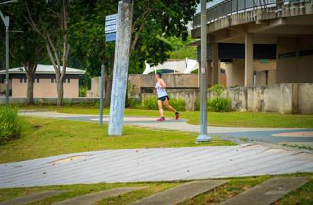 Putrajaya, Malaysia - July 18, 2022 : A man jogging at the park.のeditorial素材