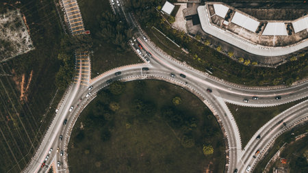 Top down aerial view of a traffic roundabout on a main road in an urban area of the Bangi, Selangor, Malaysia.の写真素材