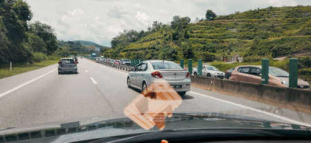 Pahang, Malaysia : View from the car window to the road with jammed road on the opposite side.の写真素材