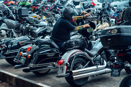 Kuala Terengganu, Malaysia - June 25, 2022: Motorcycles parking along the roadside during Terengganu bike week events.のeditorial素材