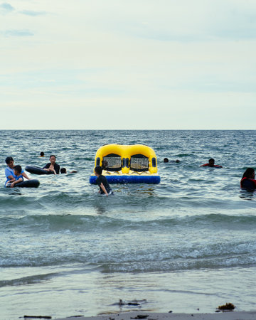 Port Dickson, Malaysia - Nov 5, 2021: Public visitors and family enjoying themselves at Port Dickson Beach.のeditorial素材