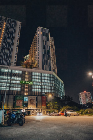 Melaka, Malaysia - Aug 25, 2022 The Shore hotel and apartment building with mall at night.のeditorial素材