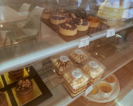 Bangi, Malaysia - Sep 19, 2022 - The caravan cafe's cakes in a display chiller container.のeditorial素材
