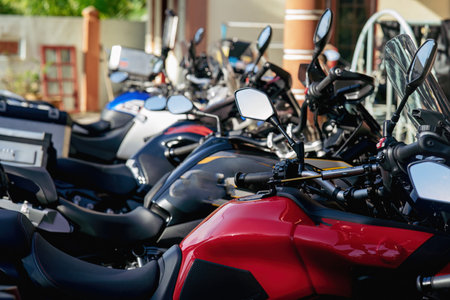 Motorcycles group parking on city street during adventure journey. Motorcyclists community travel concept.のeditorial素材