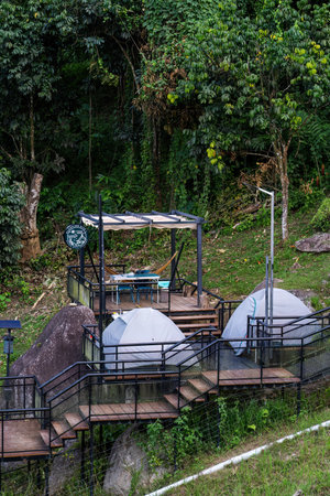 Perak, Malaysia - Oct 19, 2022 Glamour camping or glamping spaces at Kuak Hill Resort in Lenggong.のeditorial素材
