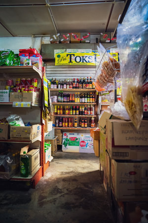 Tapah, Malaysia - Aug 12, 2022 Mini market indoor in a small town. The shelves display a variety of daily goods.のeditorial素材