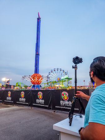 Bukit Jalil, Malaysia - Aug 16, 2022 Taking photo of  the Euro Fun Park fun fair.のeditorial素材