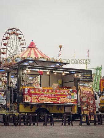 Bukit Jalil, Malaysia - Aug 16, 2022 Food trucks selling various selections at the Euro Fun Park fun fair at night.のeditorial素材