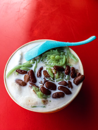 Malaysia traditional iced sweet dessert Cendol served in a bowl with coconut milk and red beans.の写真素材