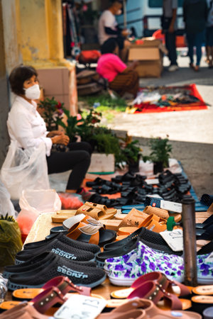 PERAK, MALAYSIA - Oct 18, 2022: Shoes on display for sale at the morning market in Karai, Kuala Kangsar.のeditorial素材