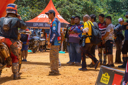 Pahang, Malaysia - Sept 24, 2022 Spectators with the winning racer during practice.のeditorial素材