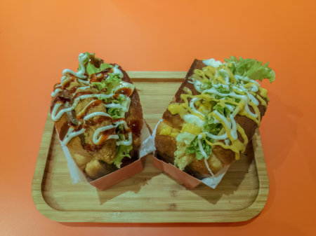 Korean Sandwich Bread or Egg Drop with Egg, Lettuce, Mayonaise, Cheese, Parsley, Sauce.の写真素材
