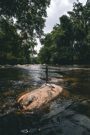 Small video camera setting up at the flowing river in Sungai Kampar, Gopeng, Perak.の写真素材