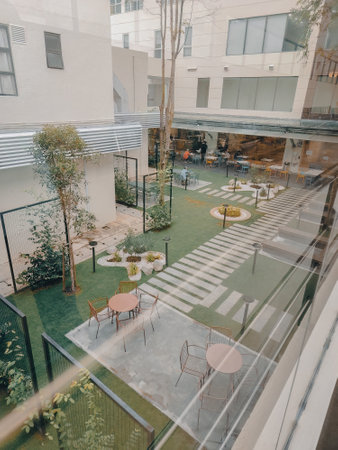 Nilai, Malaysia - June 8, 2022 Hospital garden in Nilai Medical Center. Looking through the glass wall.のeditorial素材
