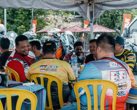 Pahang, Malaysia - Sept 24, 2022 Malay men are chatting together at the local cafe with friends.のeditorial素材