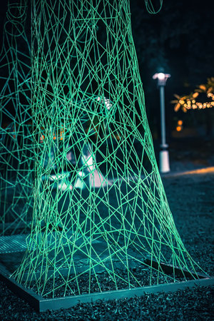 Led lights on the trees in the garden. Neon fairy party.