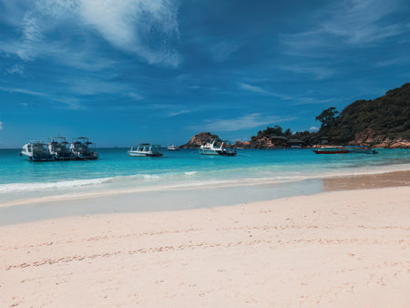 Boats, turquoise water and white sand beach, Redang Island, Malaysiaの写真素材