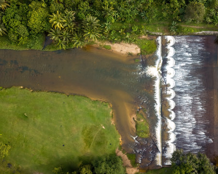 Aerial view of the Water flowing from the stream to the dam in Malaysia.の写真素材