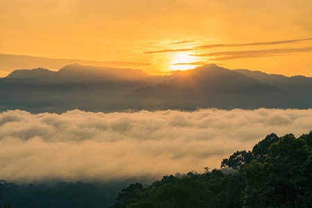 Sea clouds during golden sunrise above the Titiwangsa range mountains in Lenggong, Perak.の写真素材