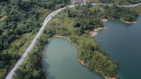 Green lake and rainforest tropical trees in Kuala Kubu Bharu, Malaysia.の写真素材