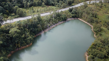 Green lake and rainforest tropical trees in Kuala Kubu Bharu, Malaysia.の写真素材